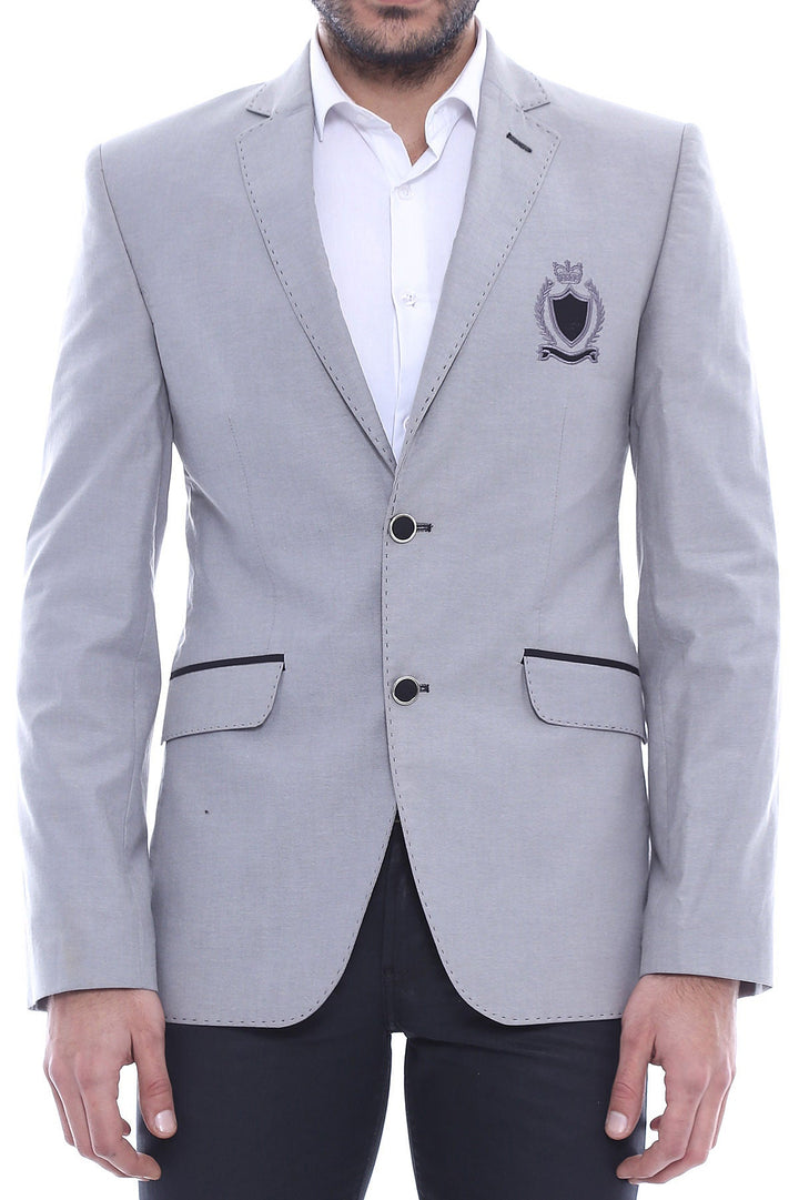 Chaqueta gris con solapa monocromática y dos botones con escudo - Wessi